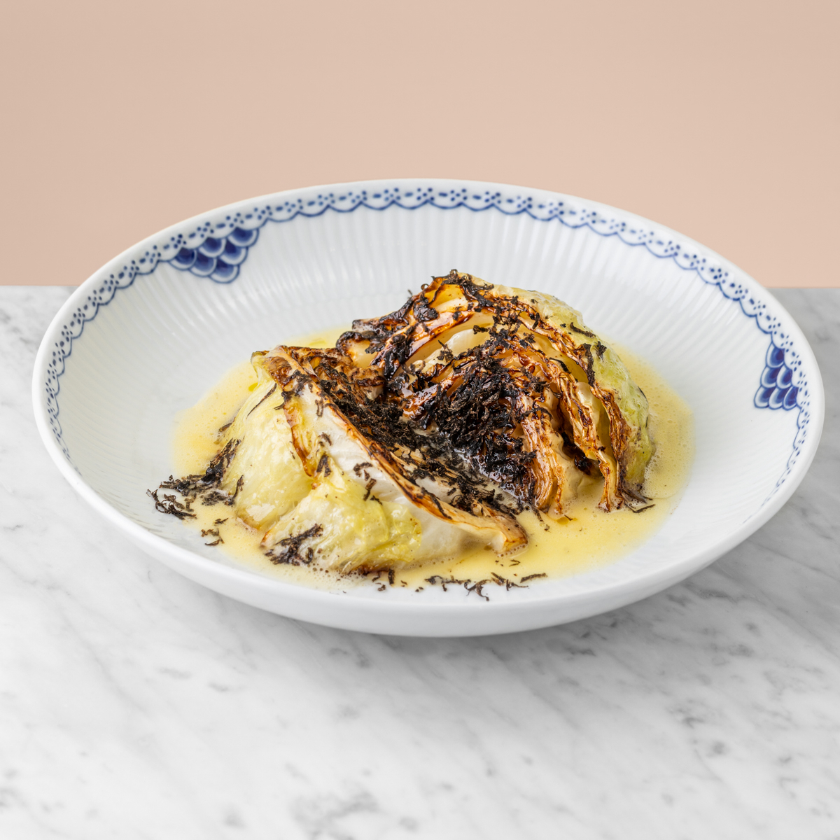 Young cabbage with black truffle.